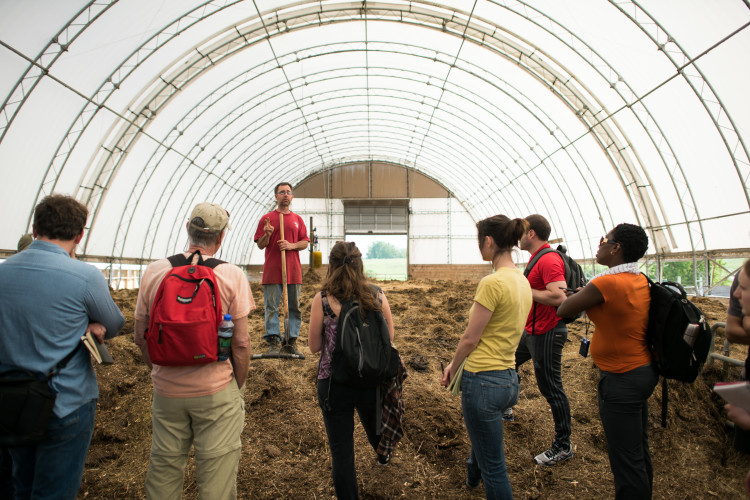 Students in hoop house on farm