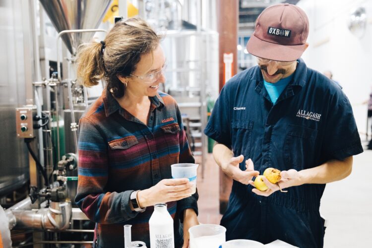 Man-in-hat-talking-to-Woman-in-flannel-shirt - UVM Professional and Continuing Education