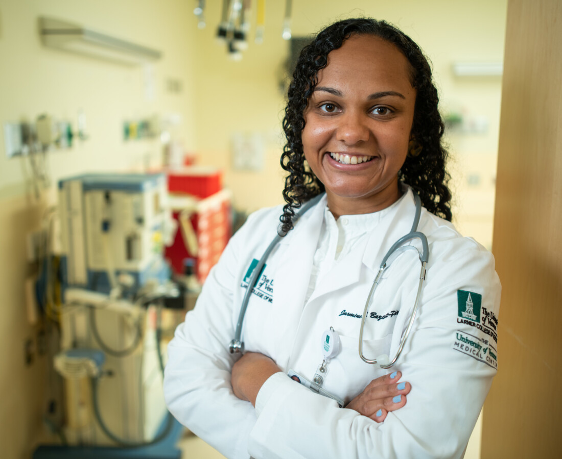 post bacc pre med student jasmine smiling wearing white coat