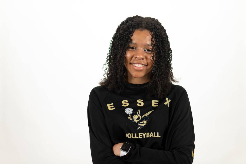 precollege student smiling Essex tshirt - UVM Professional and Continuing Education